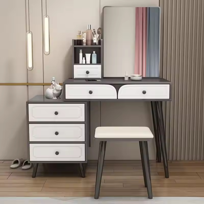 The Modern Bedroom Dressing Table is a stylish and functional furniture piece designed to enhance the beauty, organization, and convenience of your bedroom. Featuring a contemporary design with ample storage space, this dressing table provides the perfect area for makeup application, grooming, skincare routines, and organizing personal accessories. Crafted from high-quality materials, the dressing table offers exceptional durability, stability, and long-lasting performance. Its spacious tabletop provides enough room for cosmetics, perfumes, beauty products, jewelry, and decorative items, while the integrated drawers help keep essentials neatly organized and easily accessible. The sleek modern design complements a wide range of bedroom interiors, including contemporary, minimalist, Scandinavian, and luxury décor styles. Whether placed in a master bedroom, guest room, apartment, or dressing area, this dressing table adds elegance and functionality to your space. Designed to maximize organization while enhancing room aesthetics, the Modern Bedroom Dressing Table is an excellent choice for homeowners seeking practical storage and sophisticated style. Key Features Modern and elegant bedroom design Spacious tabletop for beauty essentials Multiple storage drawers for organization Durable and sturdy construction Smooth and easy-to-clean surface Suitable for makeup, grooming, and skincare routines Space-saving and functional design Complements modern and classic bedroom décor Long-lasting quality craftsmanship Ideal for homes, apartments, and guest rooms