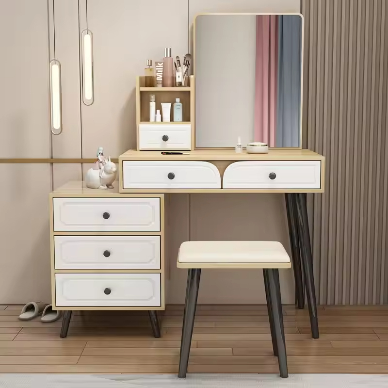 The Modern Bedroom Dressing Table is a stylish and functional furniture piece designed to enhance the beauty, organization, and convenience of your bedroom. Featuring a contemporary design with ample storage space, this dressing table provides the perfect area for makeup application, grooming, skincare routines, and organizing personal accessories. Crafted from high-quality materials, the dressing table offers exceptional durability, stability, and long-lasting performance. Its spacious tabletop provides enough room for cosmetics, perfumes, beauty products, jewelry, and decorative items, while the integrated drawers help keep essentials neatly organized and easily accessible. The sleek modern design complements a wide range of bedroom interiors, including contemporary, minimalist, Scandinavian, and luxury décor styles. Whether placed in a master bedroom, guest room, apartment, or dressing area, this dressing table adds elegance and functionality to your space. Designed to maximize organization while enhancing room aesthetics, the Modern Bedroom Dressing Table is an excellent choice for homeowners seeking practical storage and sophisticated style. Key Features Modern and elegant bedroom design Spacious tabletop for beauty essentials Multiple storage drawers for organization Durable and sturdy construction Smooth and easy-to-clean surface Suitable for makeup, grooming, and skincare routines Space-saving and functional design Complements modern and classic bedroom décor Long-lasting quality craftsmanship Ideal for homes, apartments, and guest rooms