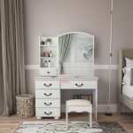 The White Dressing Table with Drawers is a stylish and functional addition to any bedroom, offering the perfect space for your daily beauty and grooming routine. Designed with a sleek white finish, this modern dressing table enhances your room with a clean, elegant look while providing ample storage for cosmetics, skincare products, jewelry, hair accessories, and personal essentials. Featuring multiple spacious drawers, this dressing table helps keep your items neatly organized and within easy reach. Its sturdy construction ensures long-lasting durability, while the smooth tabletop offers plenty of space for a mirror, perfumes, makeup organizers, and decorative accessories. The minimalist design blends effortlessly with contemporary, modern, and classic bedroom décor. Whether you're furnishing a new home or upgrading your bedroom furniture, the White Dressing Table with Drawers combines practicality, durability, and timeless style. Key Features: Elegant modern white finish Multiple spacious storage drawers Large tabletop for beauty essentials Durable and sturdy construction Smooth, easy-to-clean surface Ideal for makeup, skincare, jewelry, and accessories Compact, space-saving design Suitable for bedrooms, apartments, and dressing rooms Modern design complements various interior styles Built for everyday use and long-lasting performance
