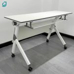 The White Foldable Office Table is a versatile and space-saving solution for offices, conference rooms, training centers, schools, and home workspaces. Designed with a sleek white tabletop and a sturdy folding frame, this table provides a practical work surface while allowing for easy storage and portability when not in use. Constructed from high-quality materials, the table is durable enough for everyday use and features a smooth, easy-to-clean surface that resists stains and scratches. Its foldable design makes it ideal for flexible work environments, temporary workstations, meetings, seminars, events, and study areas. When folded, it occupies minimal space, making storage simple and convenient. Whether you need a reliable office desk, training table, or multipurpose workstation, the White Foldable Office Table combines functionality, durability, and modern style to suit a wide range of professional and personal settings. Key Features: Modern white tabletop design Foldable frame for easy storage Strong and durable construction Spacious work surface Scratch-resistant and easy-to-clean finish Lightweight and portable Space-saving design for flexible use Ideal for offices, conference rooms, training centers, schools, and home offices Suitable for meetings, study, and multipurpose applications Quick to set up and fold away