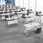 The White Foldable Office Table is a versatile and space-saving solution for offices, conference rooms, training centers, schools, and home workspaces. Designed with a sleek white tabletop and a sturdy folding frame, this table provides a practical work surface while allowing for easy storage and portability when not in use. Constructed from high-quality materials, the table is durable enough for everyday use and features a smooth, easy-to-clean surface that resists stains and scratches. Its foldable design makes it ideal for flexible work environments, temporary workstations, meetings, seminars, events, and study areas. When folded, it occupies minimal space, making storage simple and convenient. Whether you need a reliable office desk, training table, or multipurpose workstation, the White Foldable Office Table combines functionality, durability, and modern style to suit a wide range of professional and personal settings. Key Features: Modern white tabletop design Foldable frame for easy storage Strong and durable construction Spacious work surface Scratch-resistant and easy-to-clean finish Lightweight and portable Space-saving design for flexible use Ideal for offices, conference rooms, training centers, schools, and home offices Suitable for meetings, study, and multipurpose applications Quick to set up and fold away