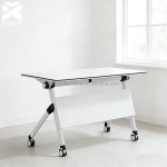The White Foldable Office Table is a versatile and space-saving solution for offices, conference rooms, training centers, schools, and home workspaces. Designed with a sleek white tabletop and a sturdy folding frame, this table provides a practical work surface while allowing for easy storage and portability when not in use. Constructed from high-quality materials, the table is durable enough for everyday use and features a smooth, easy-to-clean surface that resists stains and scratches. Its foldable design makes it ideal for flexible work environments, temporary workstations, meetings, seminars, events, and study areas. When folded, it occupies minimal space, making storage simple and convenient. Whether you need a reliable office desk, training table, or multipurpose workstation, the White Foldable Office Table combines functionality, durability, and modern style to suit a wide range of professional and personal settings. Key Features: Modern white tabletop design Foldable frame for easy storage Strong and durable construction Spacious work surface Scratch-resistant and easy-to-clean finish Lightweight and portable Space-saving design for flexible use Ideal for offices, conference rooms, training centers, schools, and home offices Suitable for meetings, study, and multipurpose applications Quick to set up and fold away