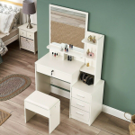 Vanity Dressing Table with LED The Vanity Dressing Table with LED is a stylish choice for modern bedrooms and dressing areas. It combines a mirror, a tabletop, and LED lights to create a useful space for daily grooming. The lights brighten the mirror area, making it easier to apply makeup and style your hair. The tabletop also provides space for perfumes, brushes, skincare products, and other beauty items. Additionally, its modern design adds beauty to your bedroom. You can pair it with a dressing stool, bedroom wardrobe, or matching furniture for a complete look. Whether you are getting ready for work or preparing for a special event, this dressing table makes your routine easier. It is suitable for bedrooms, apartments, and personal dressing spaces. The Vanity Dressing Table with LED helps keep your beauty products neat and easy to reach. Its illuminated mirror provides extra light for makeup and skincare routines. Depending on the model, it may include drawers, shelves, and adjustable lighting settings. These features help you organise your cosmetics and accessories. Before buying, check the table size, mirror dimensions, storage space, and power requirements. Make sure it fits well in your bedroom and has access to a suitable power source. You can clean the mirror with a suitable glass cleaner and wipe the table with a soft cloth. Also, follow the manufacturer's instructions when caring for the LED lights. If you want a dressing space that combines lighting, storage, and modern style, this vanity table is a practical addition to your home. - LED Mirror Lighting: Brightens the dressing area for daily grooming. - Useful Tabletop: Holds makeup, perfumes, and skincare products. - Storage Space: Helps organise beauty items and accessories. - Modern Design: Complements contemporary bedroom furniture. - Multiple Uses: Suitable for makeup, skincare, and hairstyling. - Easy Cleaning: Wipe surfaces with suitable cleaning products.