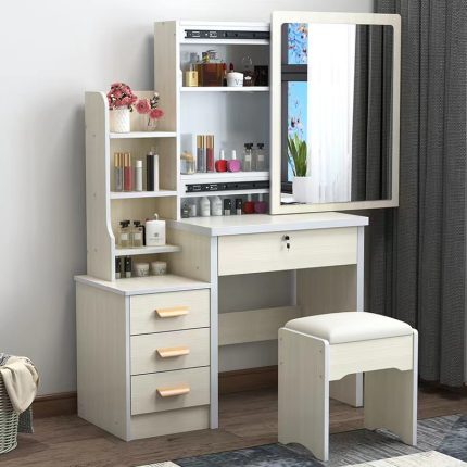 Vanity Dressing Table with LED The Vanity Dressing Table with LED is a stylish choice for modern bedrooms and dressing areas. It combines a mirror, a tabletop, and LED lights to create a useful space for daily grooming. The lights brighten the mirror area, making it easier to apply makeup and style your hair. The tabletop also provides space for perfumes, brushes, skincare products, and other beauty items. Additionally, its modern design adds beauty to your bedroom. You can pair it with a dressing stool, bedroom wardrobe, or matching furniture for a complete look. Whether you are getting ready for work or preparing for a special event, this dressing table makes your routine easier. It is suitable for bedrooms, apartments, and personal dressing spaces. The Vanity Dressing Table with LED helps keep your beauty products neat and easy to reach. Its illuminated mirror provides extra light for makeup and skincare routines. Depending on the model, it may include drawers, shelves, and adjustable lighting settings. These features help you organise your cosmetics and accessories. Before buying, check the table size, mirror dimensions, storage space, and power requirements. Make sure it fits well in your bedroom and has access to a suitable power source. You can clean the mirror with a suitable glass cleaner and wipe the table with a soft cloth. Also, follow the manufacturer's instructions when caring for the LED lights. If you want a dressing space that combines lighting, storage, and modern style, this vanity table is a practical addition to your home. - LED Mirror Lighting: Brightens the dressing area for daily grooming. - Useful Tabletop: Holds makeup, perfumes, and skincare products. - Storage Space: Helps organise beauty items and accessories. - Modern Design: Complements contemporary bedroom furniture. - Multiple Uses: Suitable for makeup, skincare, and hairstyling. - Easy Cleaning: Wipe surfaces with suitable cleaning products.